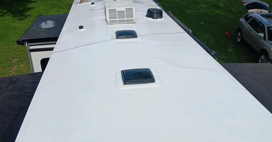 Completed seamless white RV roof coating on a real Coastal Care Detail project